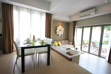 Dining and Living Area with Pool and Garden View